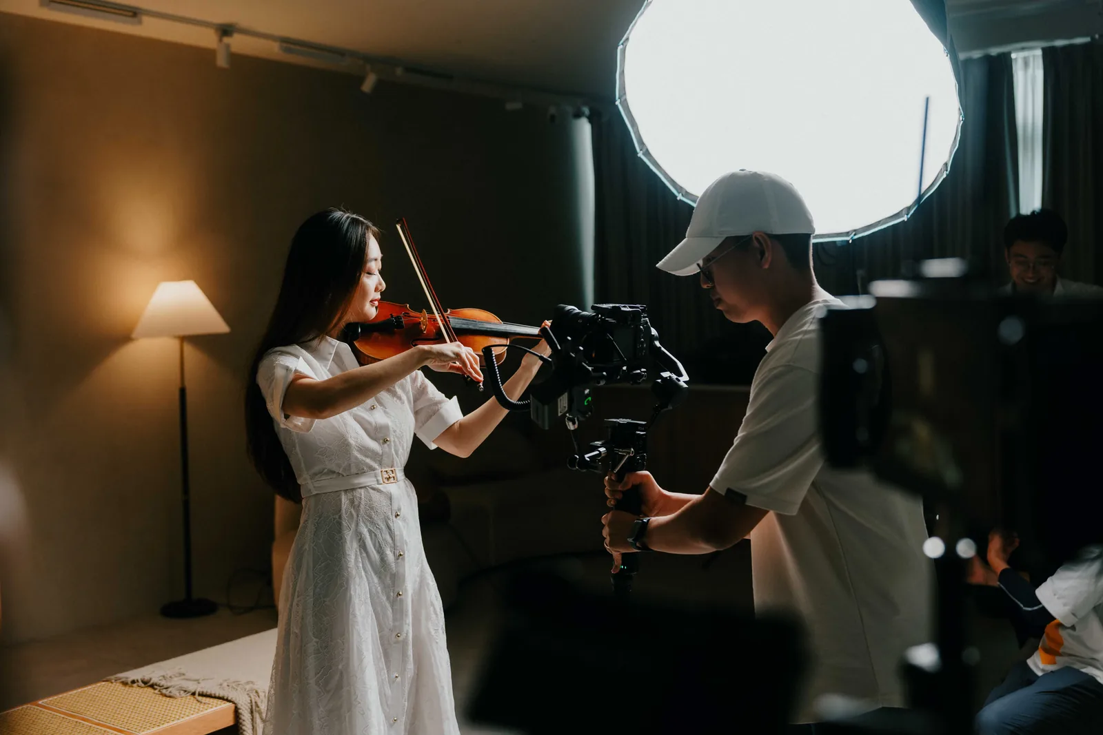 Live workshop filming practice with a violinist