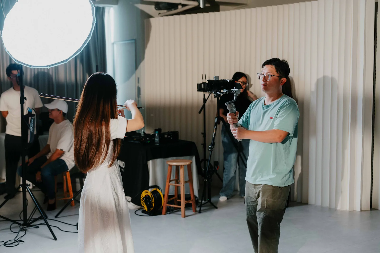 Student filming during a live workshop